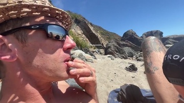 Screenshot PUBLIC BEACH - Big Tits Girl sucks Dick at nude beach surrounded by voyeurs