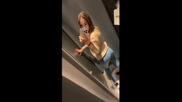 Screenshot A slutty woman masturbates in a mall fitting room for all to see – a steamy show